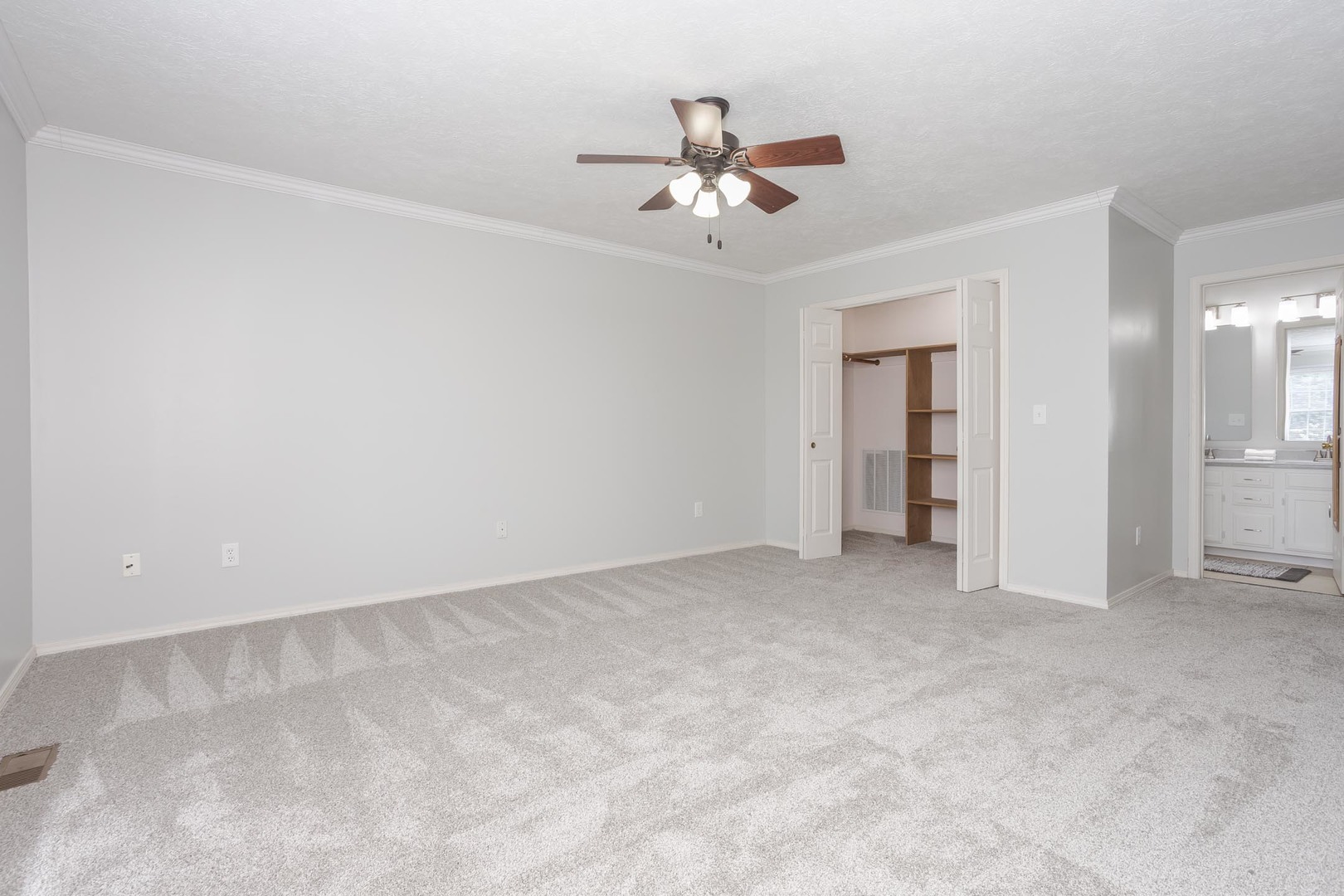 814 Landau Lane Normal, IL 61761 - Photo 34 of 58 an empty room with closet and fan