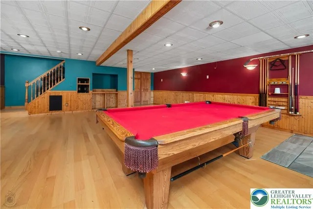 a room with pool table and a table