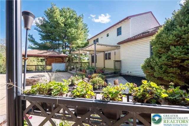 front view of a house with a flower garden