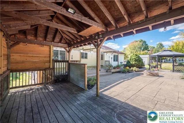 a view of a porch with wooden floor