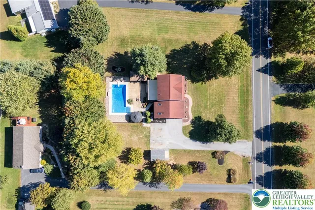 an aerial view of residential houses with outdoor space