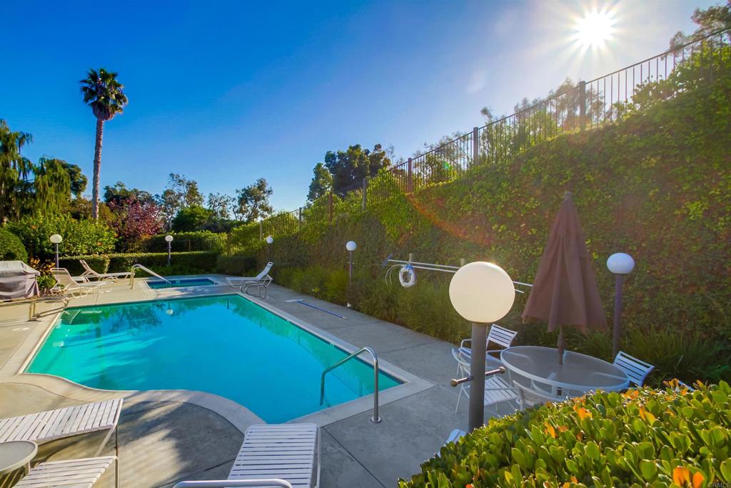 864 Del Mar Downs Road Solana Beach, CA 92075 - Photo 19 of 20 a view of a swimming pool with a table and chairs