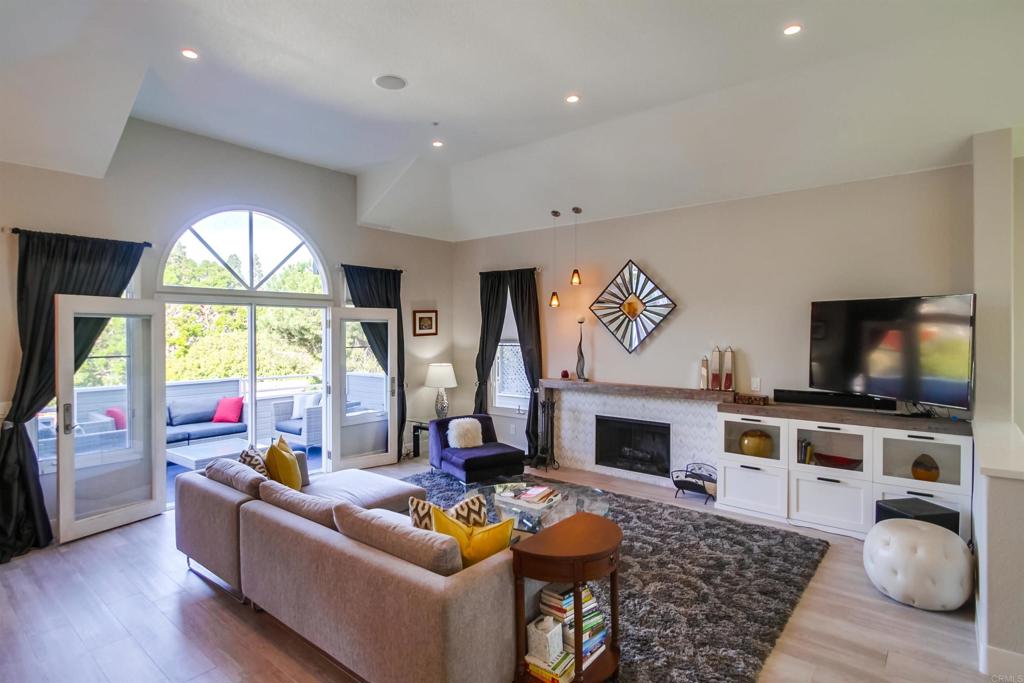 864 Del Mar Downs Road Solana Beach, CA 92075 - Photo 4 of 20 a living room with fireplace furniture and a flat screen tv