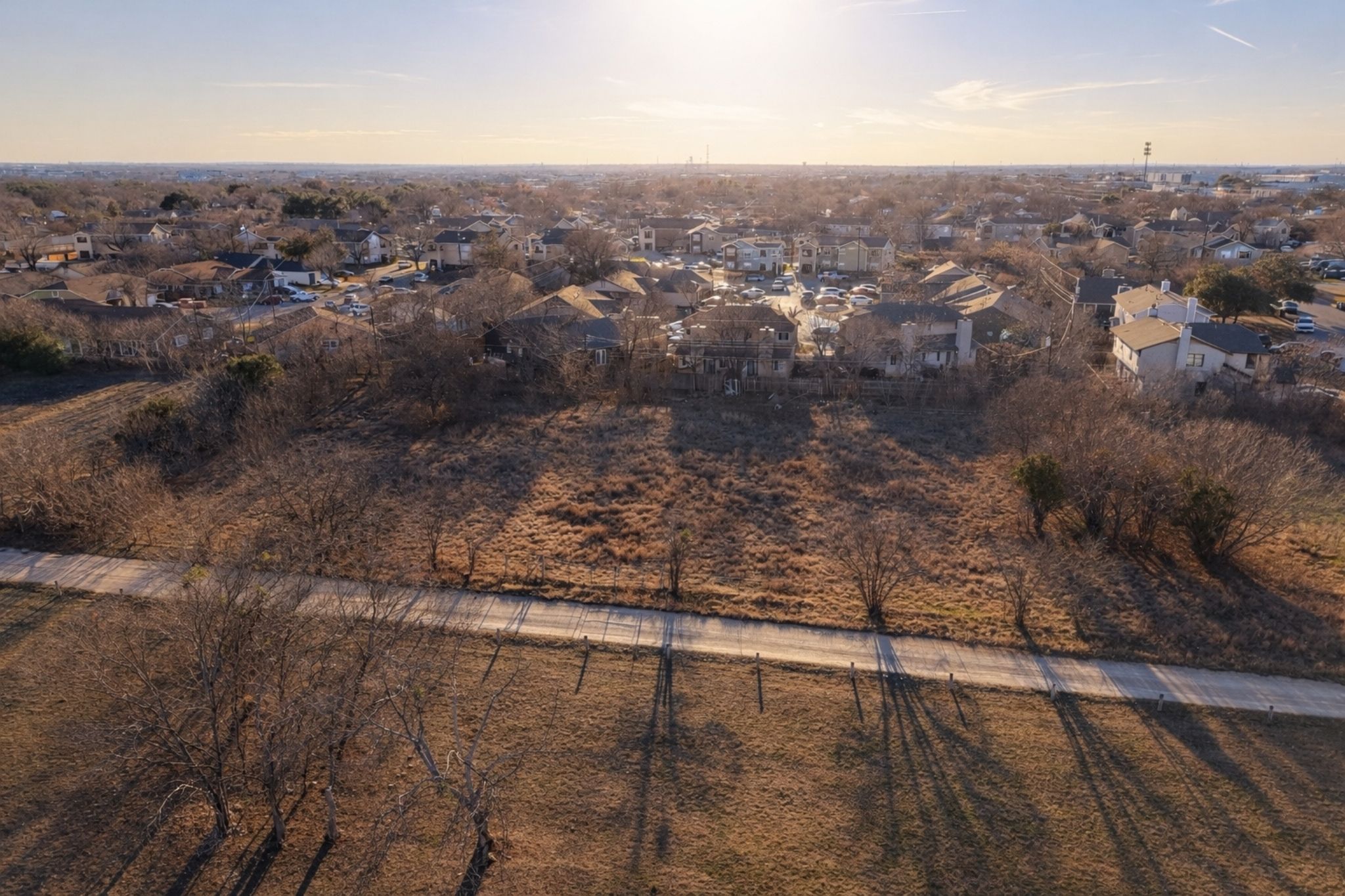 902 East Bowman Road Round Rock, TX 78664 - Photo 4 of 5 an aerial view of residential houses with outdoor space