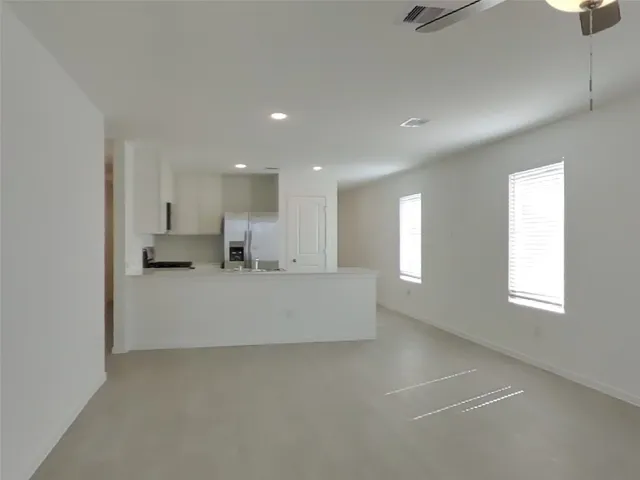 a view of kitchen and windows