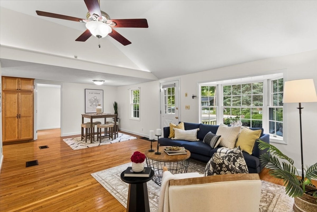 83 River Road Norfolk, MA 02056 - Photo 13 of 27 a living room with furniture and a large window