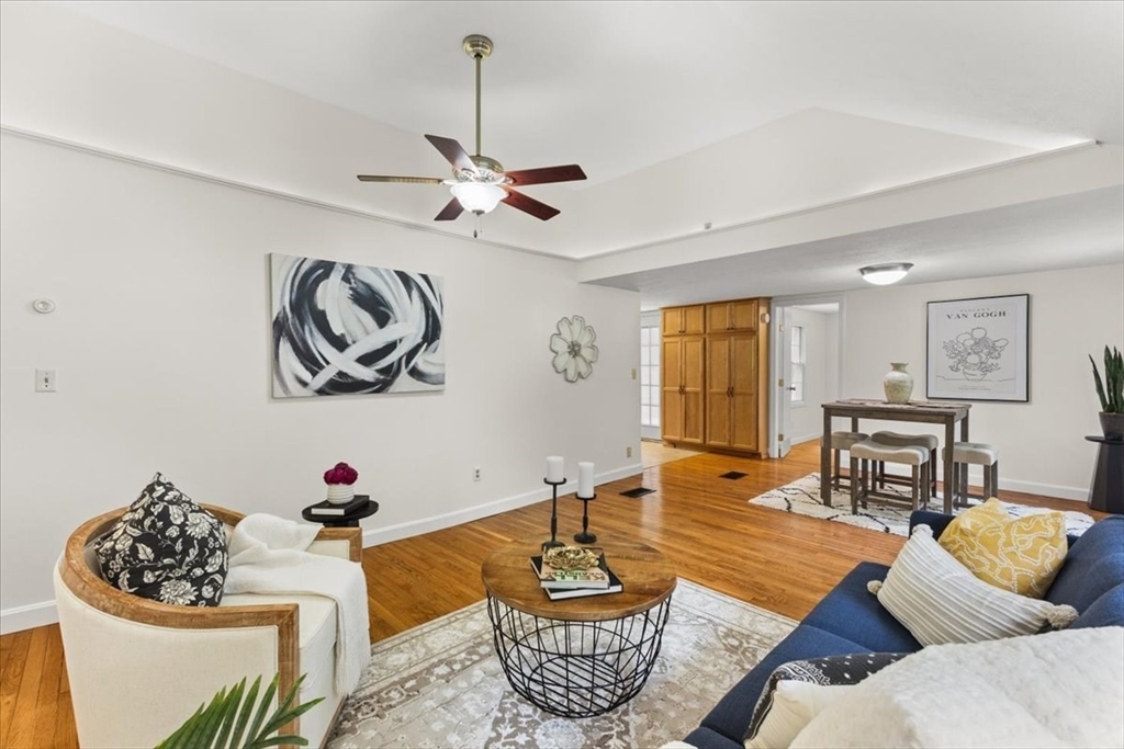 83 River Road Norfolk, MA 02056 - Photo 15 of 27 a living room with furniture and a table