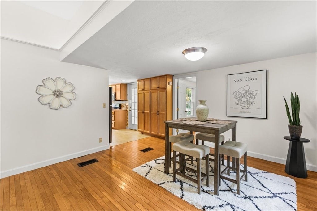 83 River Road Norfolk, MA 02056 - Photo 16 of 27 a view of a dining room with furniture window and wooden floor