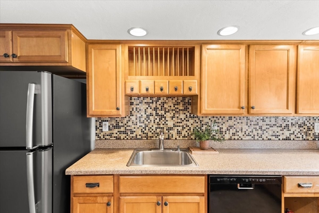 83 River Road Norfolk, MA 02056 - Photo 21 of 27 a bathroom with a sink and a large mirror