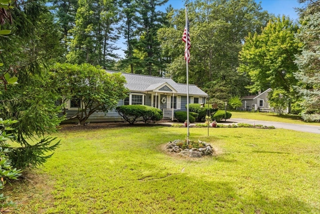 83 River Road Norfolk, MA 02056 - Photo 4 of 27 a swimming pool with outdoor seating and yard