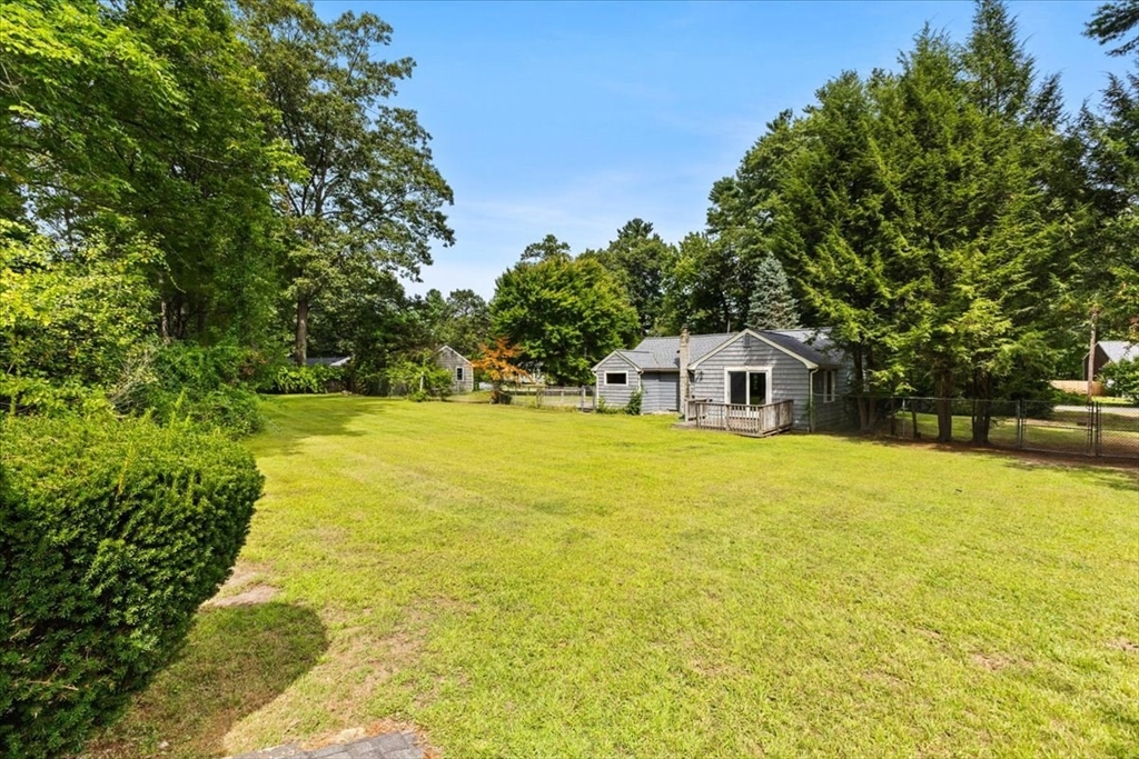 83 River Road Norfolk, MA 02056 - Photo 6 of 27 a house view with swimming pool in front of the house