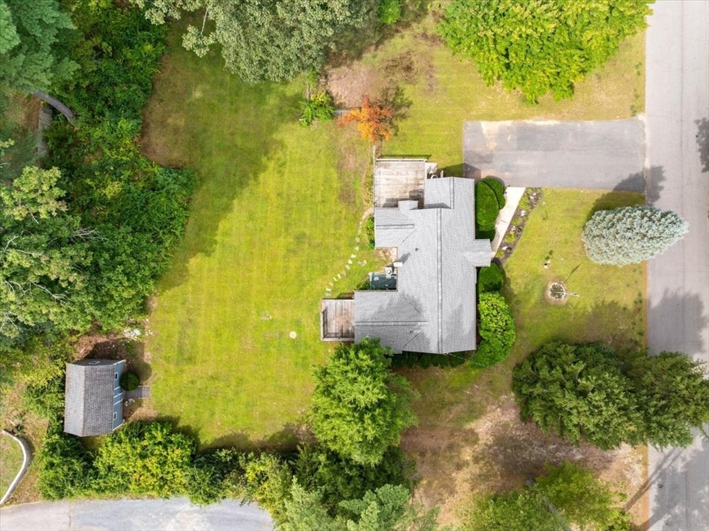83 River Road Norfolk, MA 02056 - Photo 9 of 27 an aerial view of a house with a yard