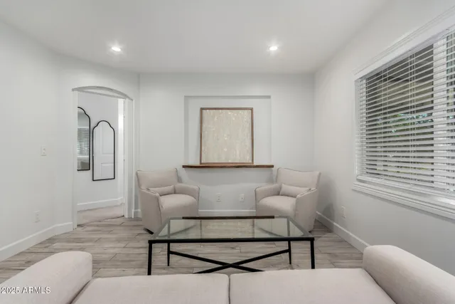 a living room with furniture and a window
