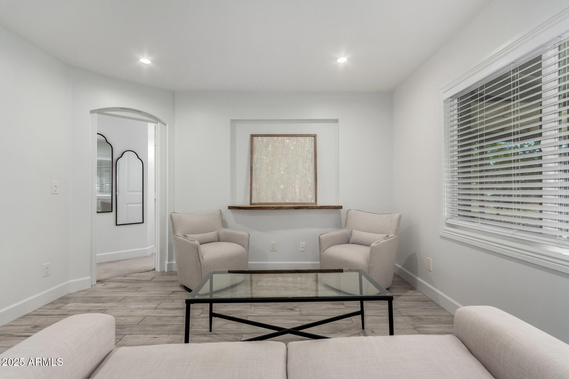 6741 North 10th Street Phoenix, AZ 85014 - Photo 11 of 37 a living room with furniture and a window