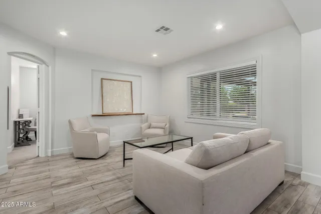a living room with furniture and a window