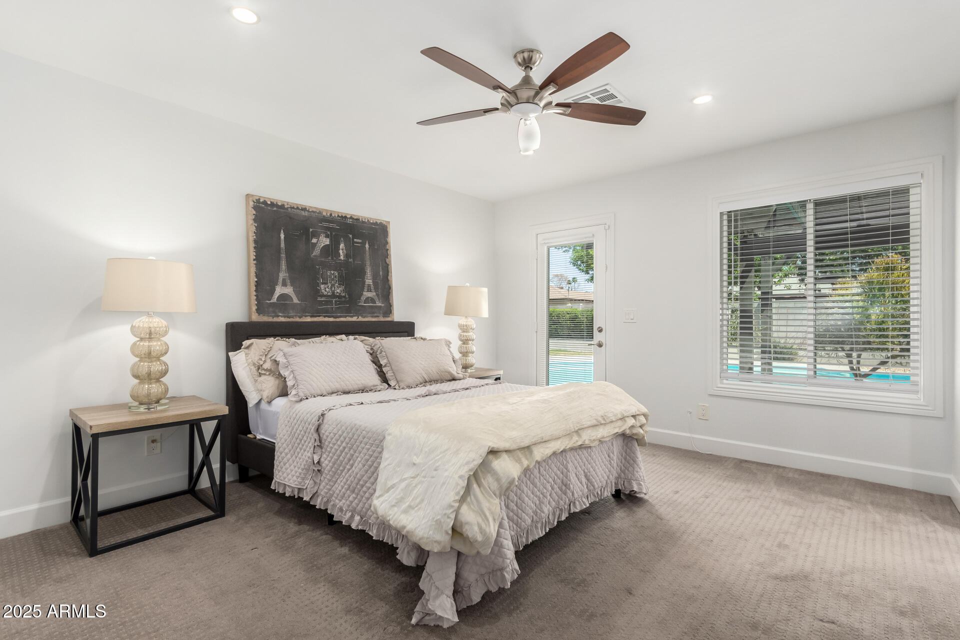 6741 North 10th Street Phoenix, AZ 85014 - Photo 15 of 37 a large bed sitting in a bedroom next to a window