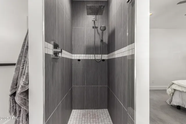 a bathroom with a glass shower door