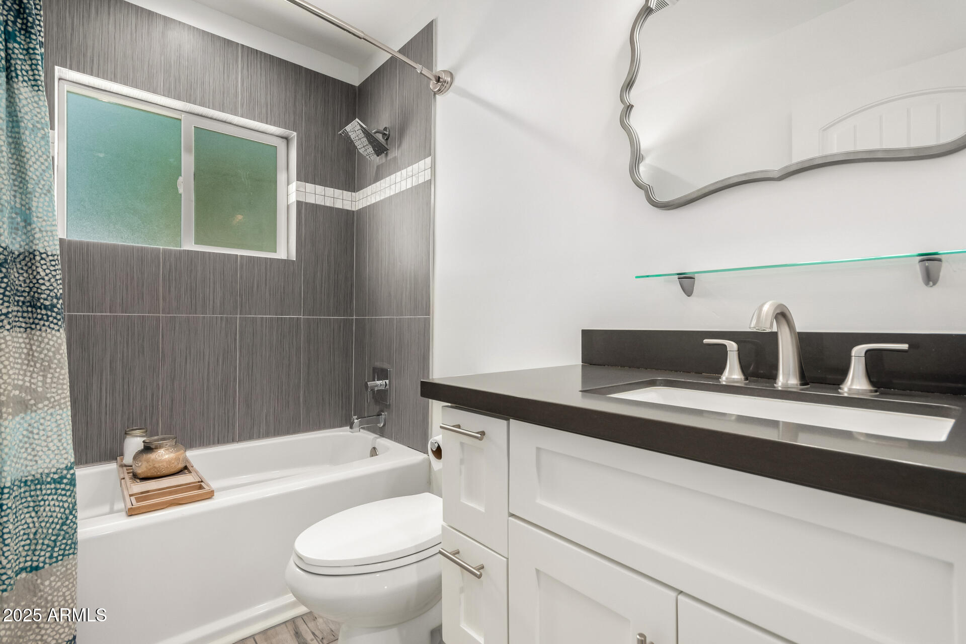 6741 North 10th Street Phoenix, AZ 85014 - Photo 23 of 37 a bathroom with a sink a toilet and a mirror