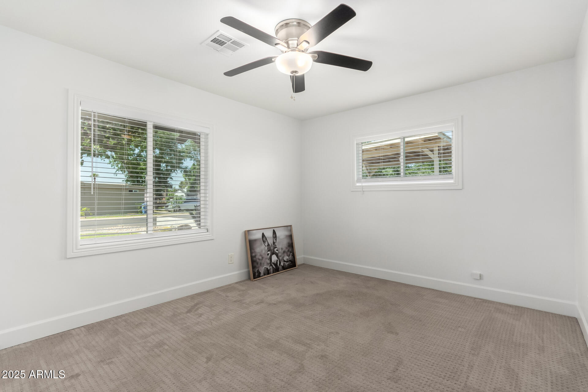 6741 North 10th Street Phoenix, AZ 85014 - Photo 24 of 37 a view of an empty room with a window