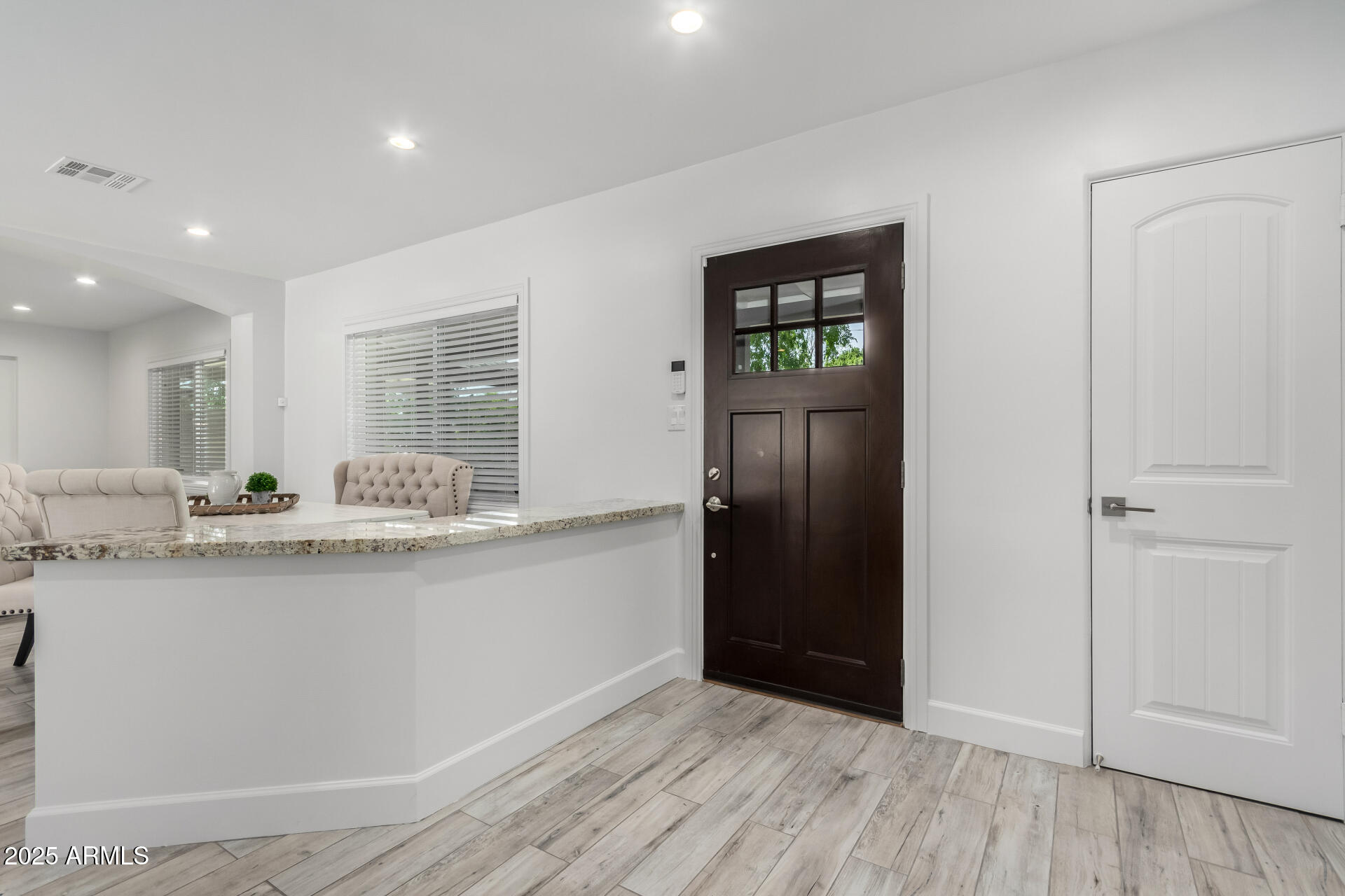6741 North 10th Street Phoenix, AZ 85014 - Photo 29 of 37 a kitchen with granite countertop a refrigerator and a sink