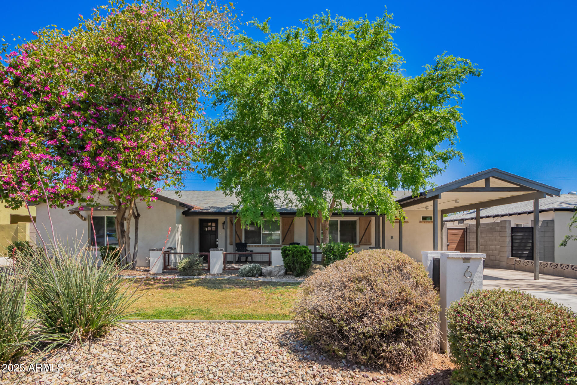 6741 North 10th Street Phoenix, AZ 85014 - Photo 30 of 37 a front view of a house with garden