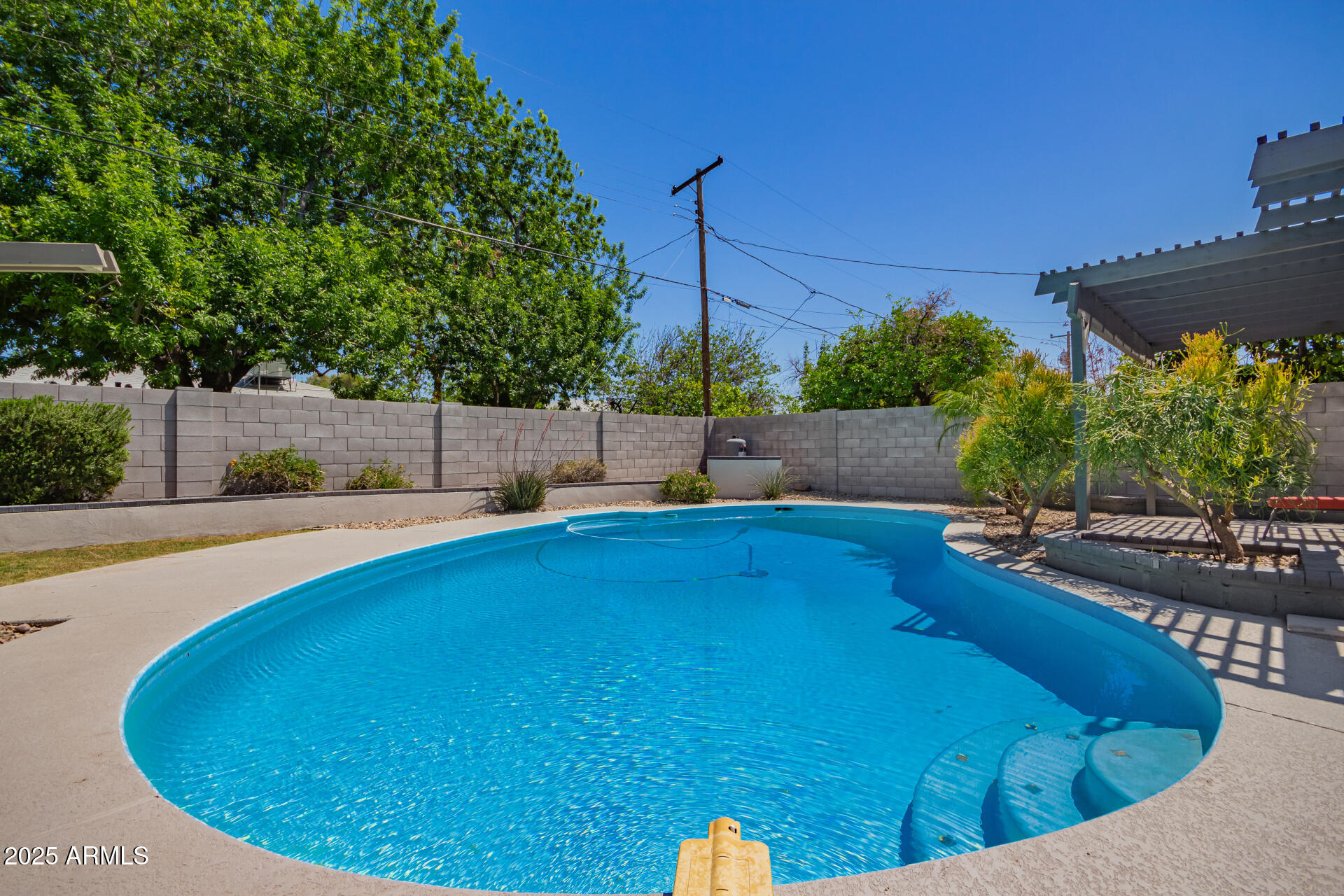 6741 North 10th Street Phoenix, AZ 85014 - Photo 33 of 37 a view of a swimming pool and sitting area