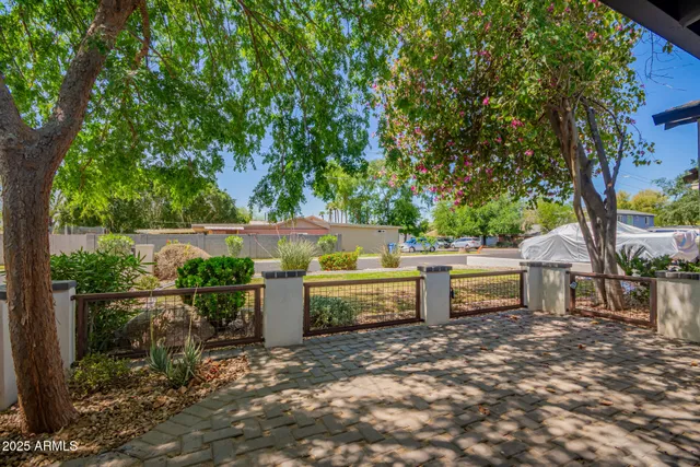 a view of a backyard with sitting area