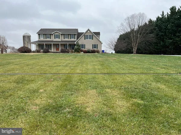a view of a house with a big yard