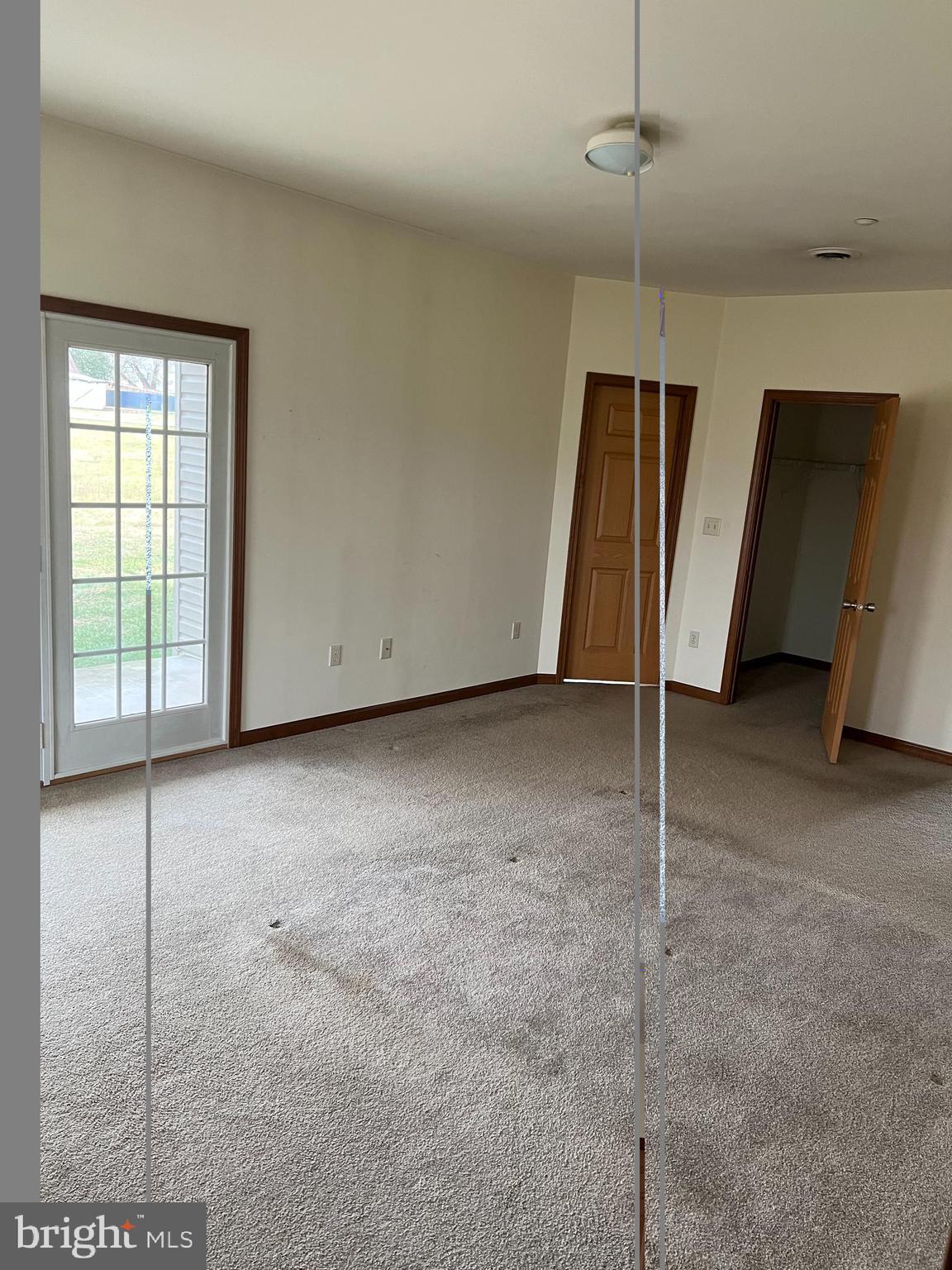 3925 Cap Stine Road Frederick, MD 21703 - Photo 6 of 8 a view of an empty room with a window