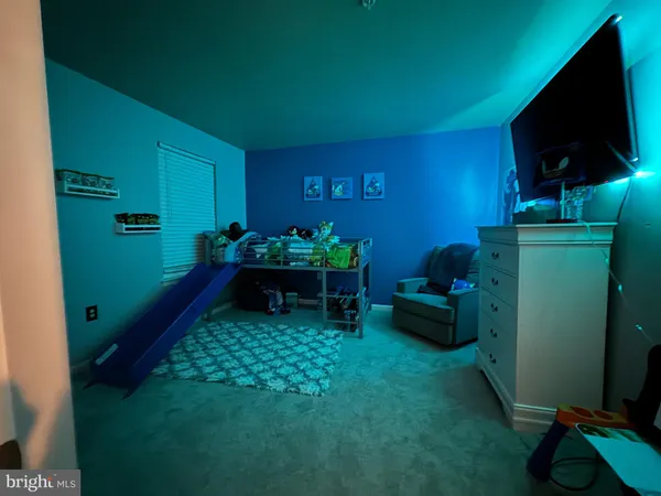 a room with furniture and a flat screen tv