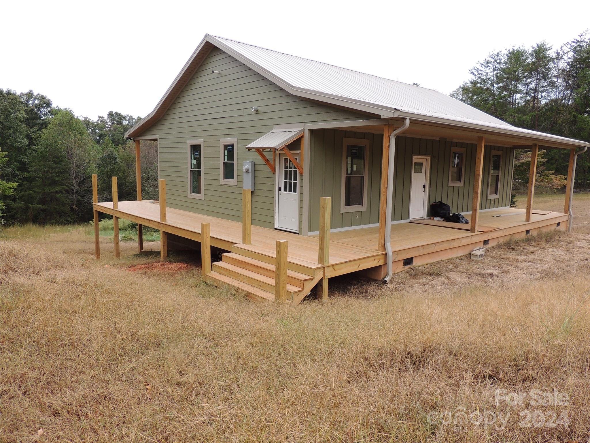 119 Sasafras Ridge Rutherfordton, NC 28139 - Photo 1 of 36 a view of a house with a yard and sitting area
