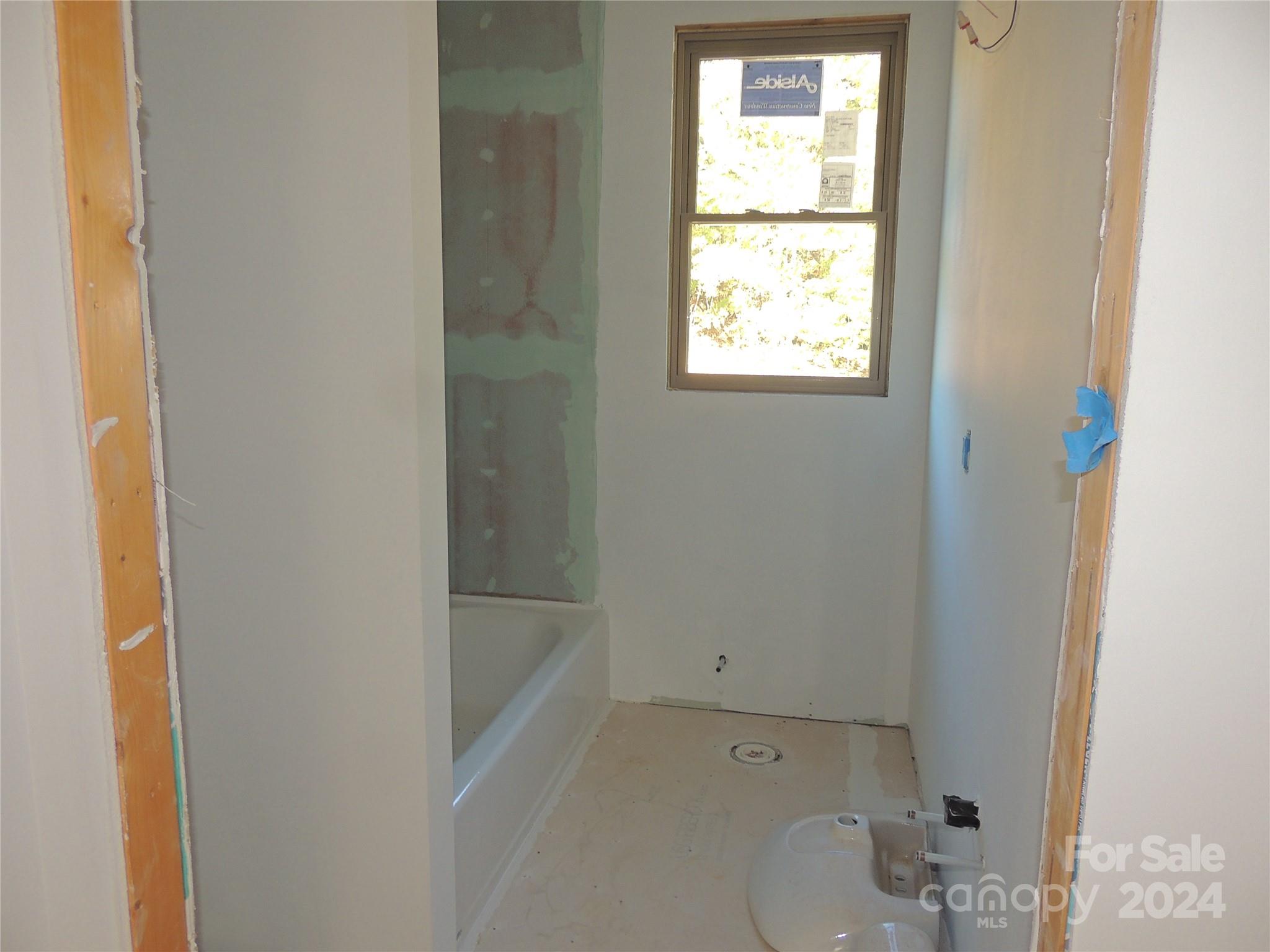 119 Sasafras Ridge Rutherfordton, NC 28139 - Photo 23 of 36 a bath room with a toilet and a bath tub