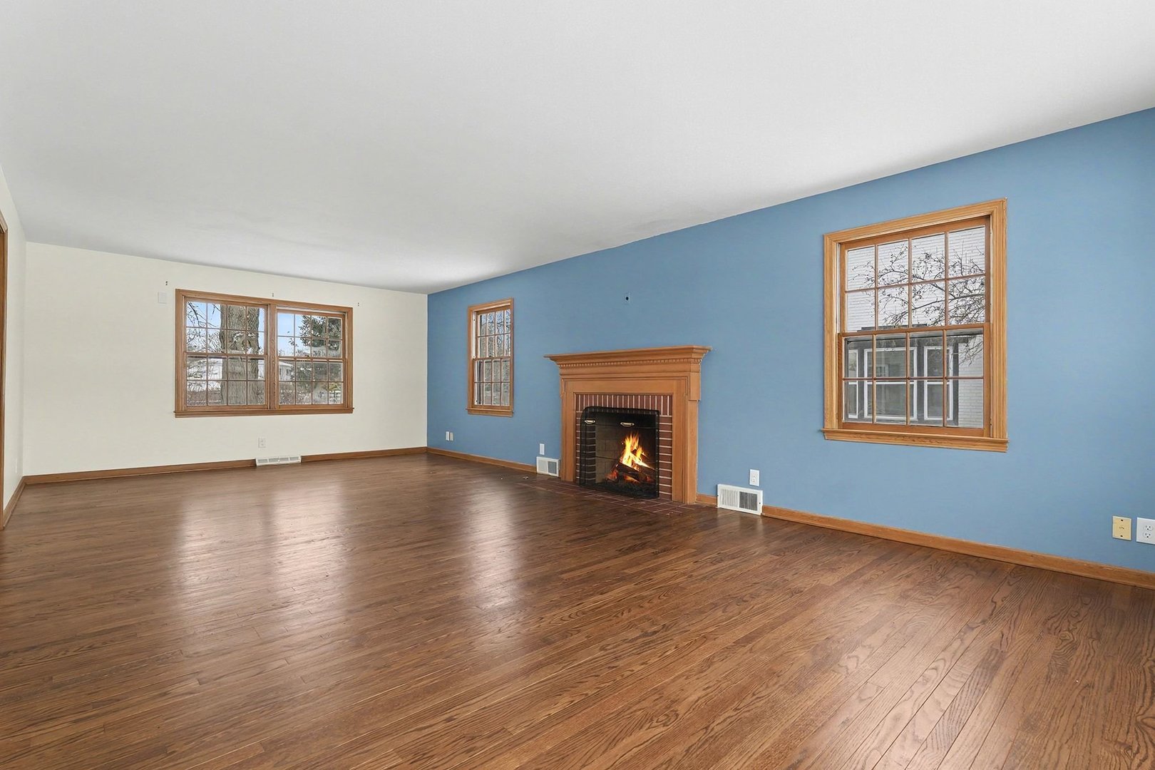33 South Canterbury Road Aurora, IL 60506 - Photo 3 of 28 a view of an empty room with wooden floor and a window