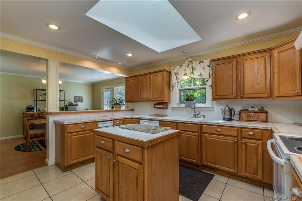 2437 Maple Creek Road Rutherfordton, NC 28139 - Photo 11 of 24 a kitchen with a sink stove and cabinets
