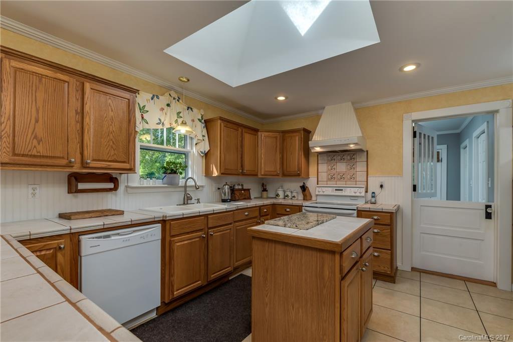2437 Maple Creek Road Rutherfordton, NC 28139 - Photo 12 of 24 a kitchen with a sink stove and cabinets
