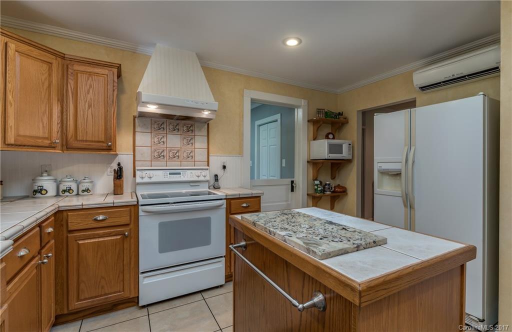 2437 Maple Creek Road Rutherfordton, NC 28139 - Photo 13 of 24 a kitchen with a sink stove and refrigerator