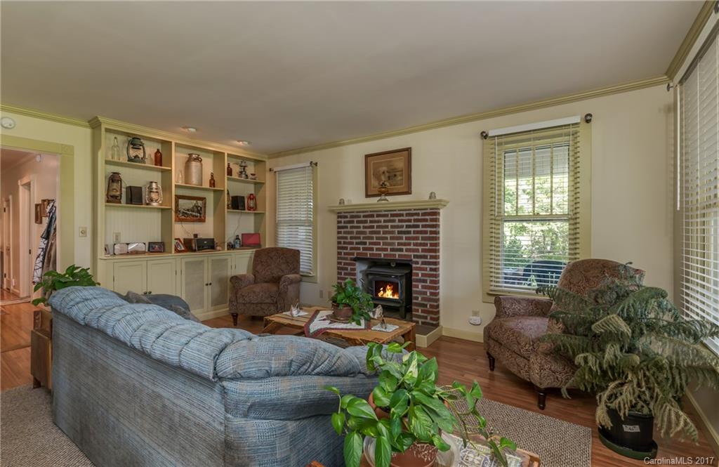 2437 Maple Creek Road Rutherfordton, NC 28139 - Photo 16 of 24 a living room with furniture and a fireplace