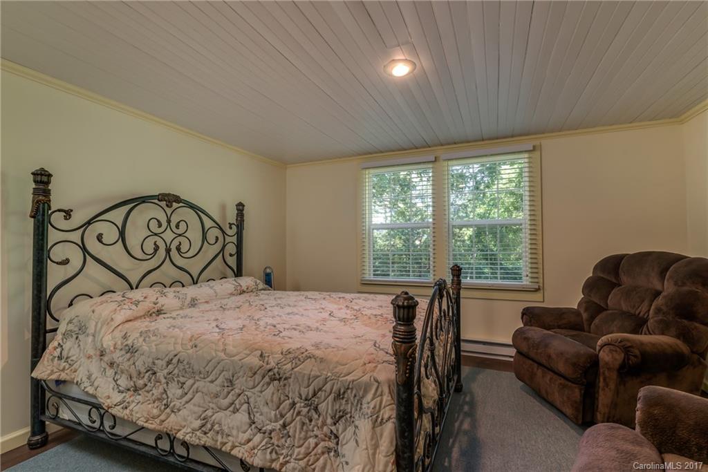 2437 Maple Creek Road Rutherfordton, NC 28139 - Photo 17 of 24 a bedroom with a bed couch and window
