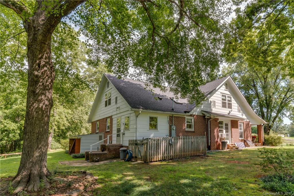 2437 Maple Creek Road Rutherfordton, NC 28139 - Photo 4 of 24 a front view of a house with a garden