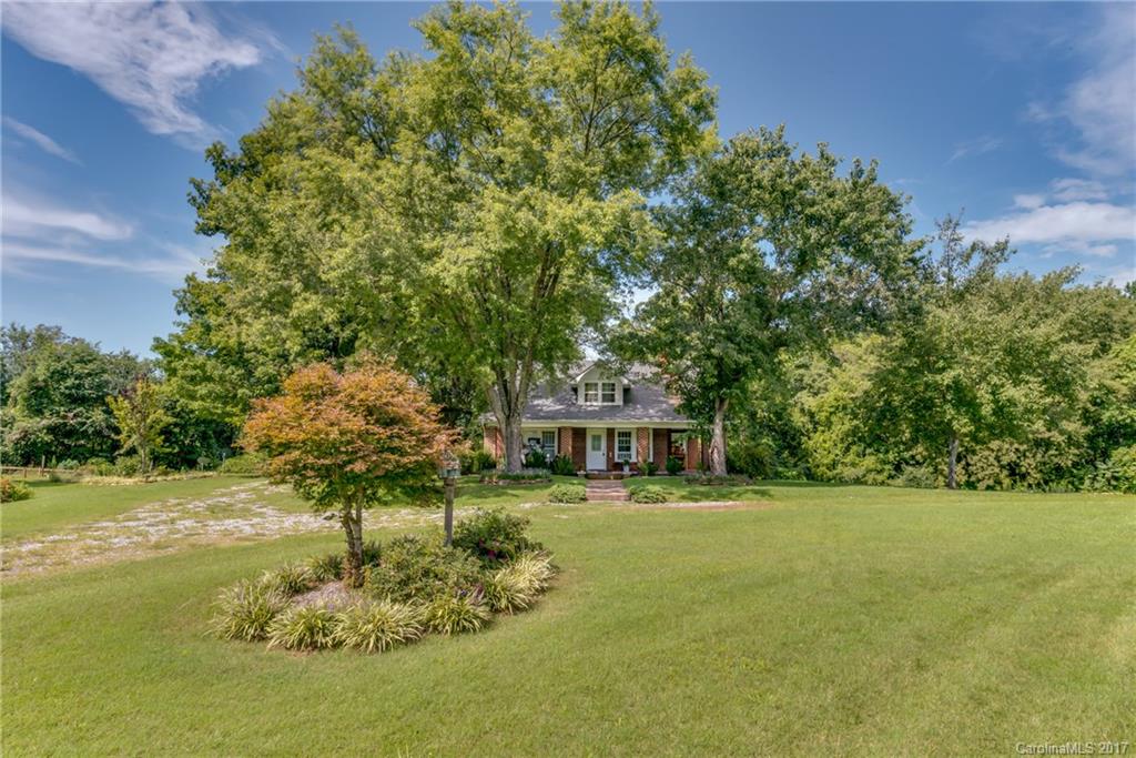2437 Maple Creek Road Rutherfordton, NC 28139 - Photo 7 of 24 a swimming pool with outdoor seating and yard