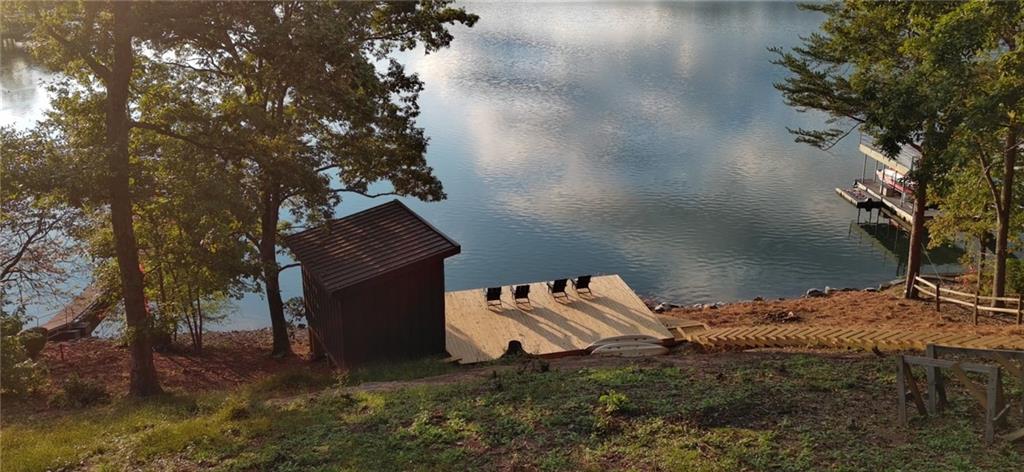 Lot 3 Lake Breeze Acres Other-north Carolina Nc 28904 Hayesville, NC 28904 - Photo 11 of 25 a backyard of a house with table and chairs