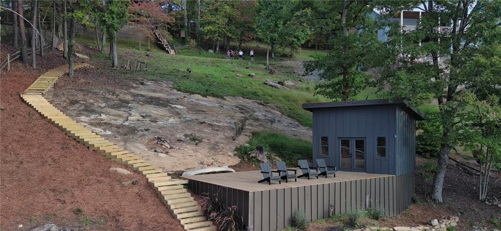 Lot 3 Lake Breeze Acres Other-north Carolina Nc 28904 Hayesville, NC 28904 - Photo 23 of 25 a view of a deck with a table and chairs