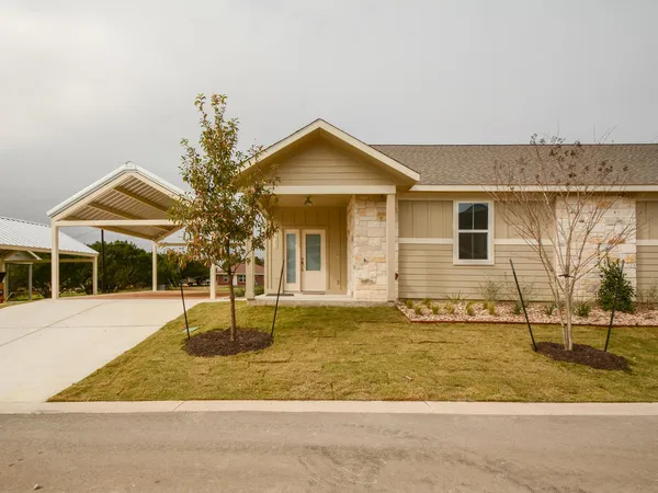 front view of a house with a yard