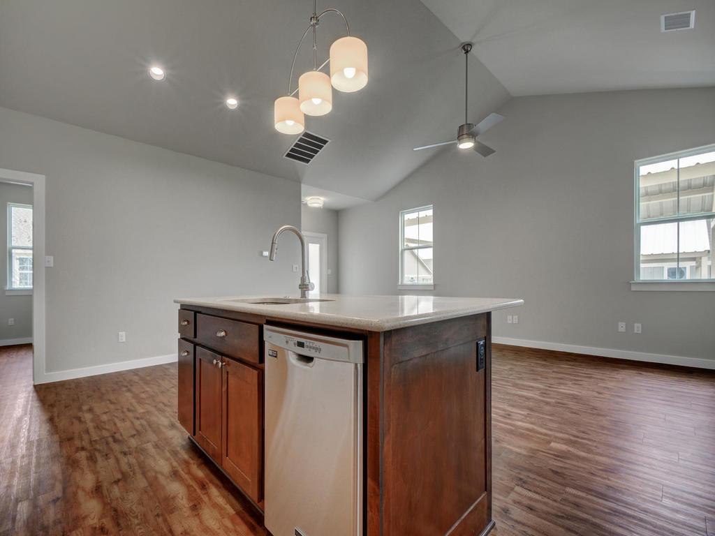 240 Rose Drive, Unit A Dripping Springs, TX 78620 - Photo 30 of 30 wooden floor in an empty room with a window