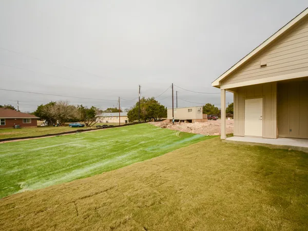 a view of a field with a big yard