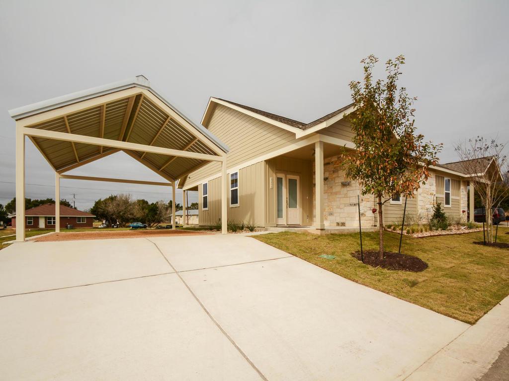 240 Rose Drive, Unit A Dripping Springs, TX 78620 - Photo 4 of 30 a view of a house with entertaining space