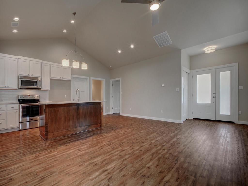 240 Rose Drive, Unit A Dripping Springs, TX 78620 - Photo 29 of 30 a view of kitchen with sink and microwave