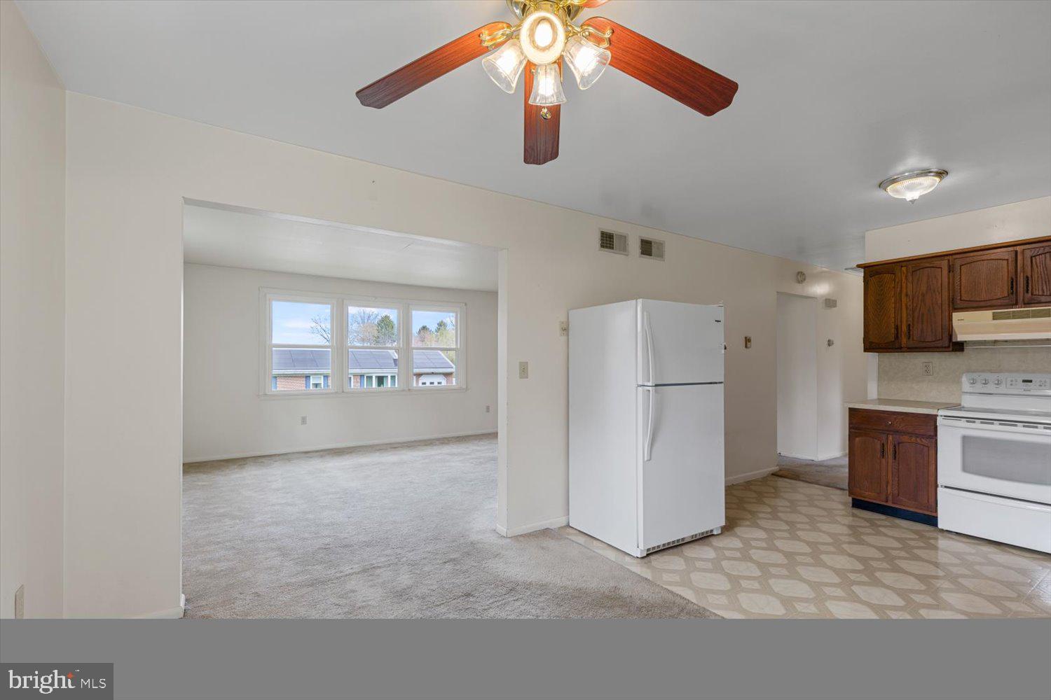 134 Bomberger Road Akron, PA 17501 - Photo 6 of 20 a view of a kitchen with a sink refrigerator and window