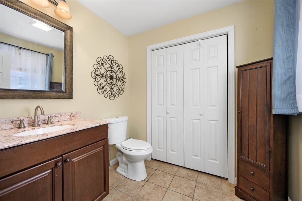 138 Sprague Street Fall River, MA 02724 - Photo 13 of 34 a bathroom with a toilet sink and mirror
