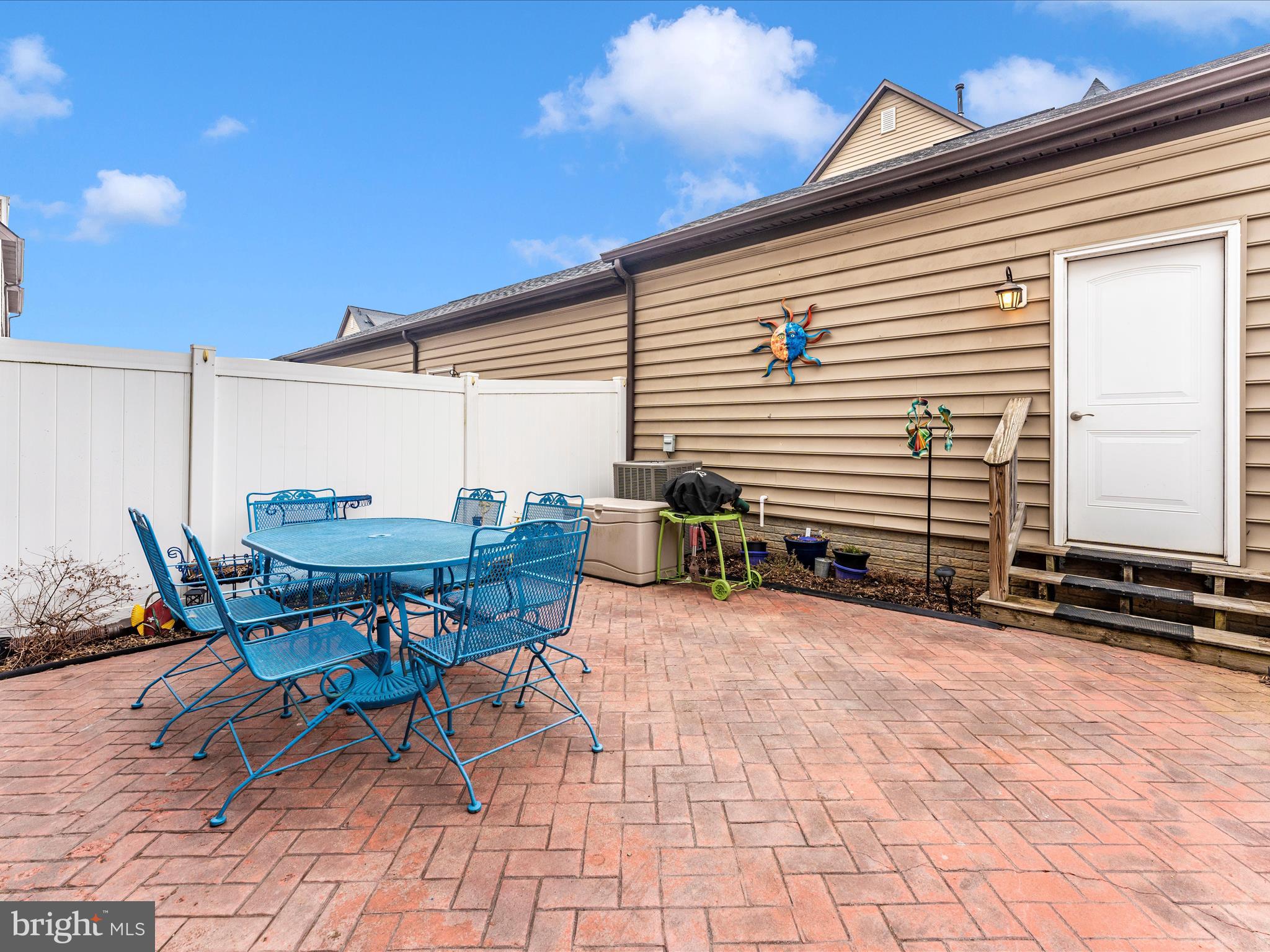 1167 Holden Road Frederick, MD 21701 - Photo 54 of 67 a backyard of a house with table and chairs